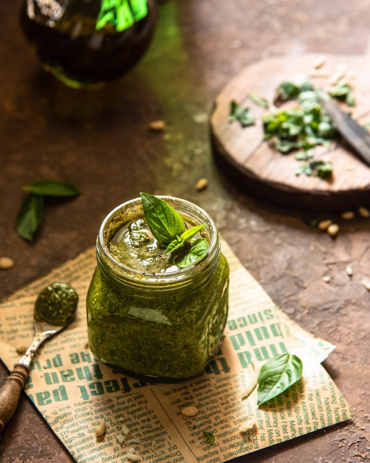 A jar of fresh green basil pesto