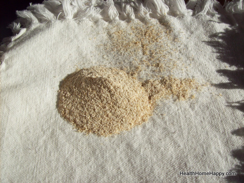 A pile of fresh whole-grain flour milled at home on a cloth