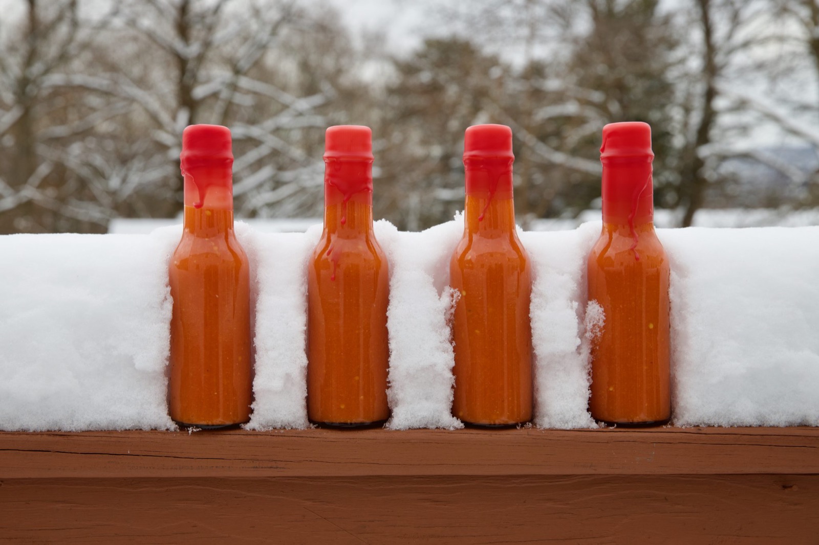 Bottles of homemade red hot sauce