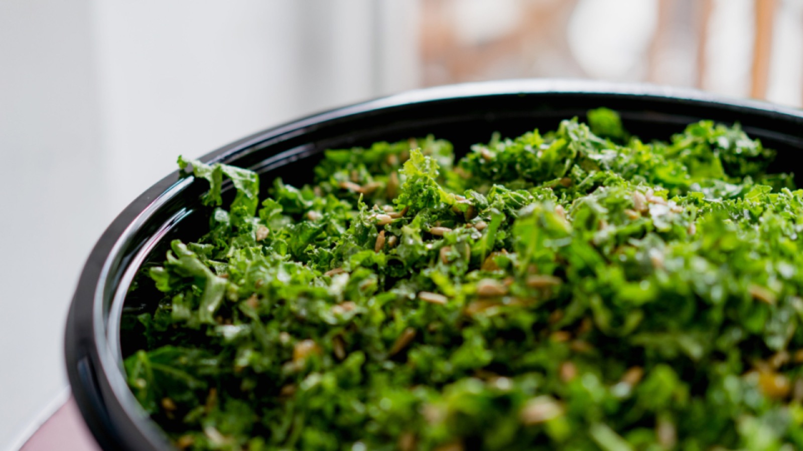 A bowl of massaged kale salad